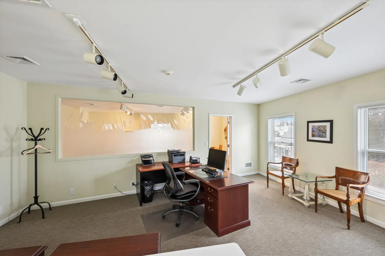 a workspace with furniture and a window