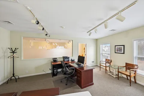 a workspace with furniture and a window