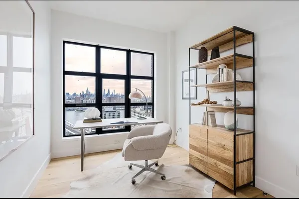 a workspace with furniture and a window
