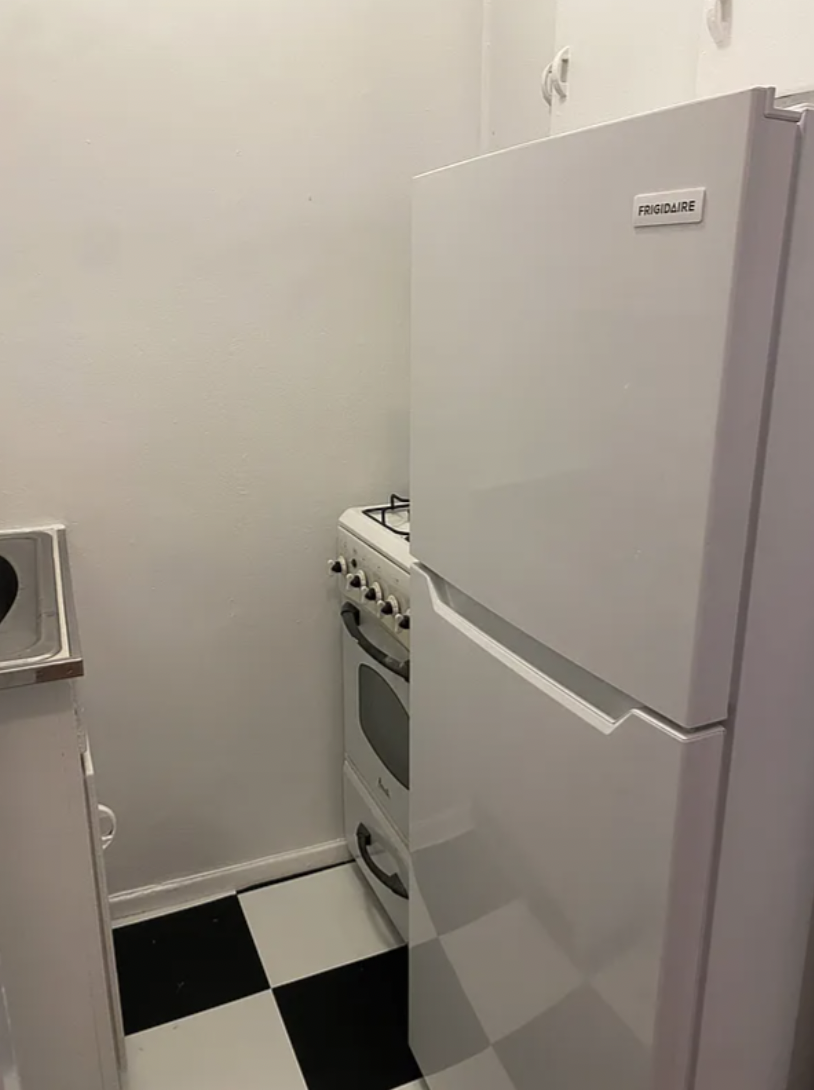 180 West Houston Street, Unit 4C Manhattan, NY 10014 - Photo 4 of 10 a room with a dryer and washer