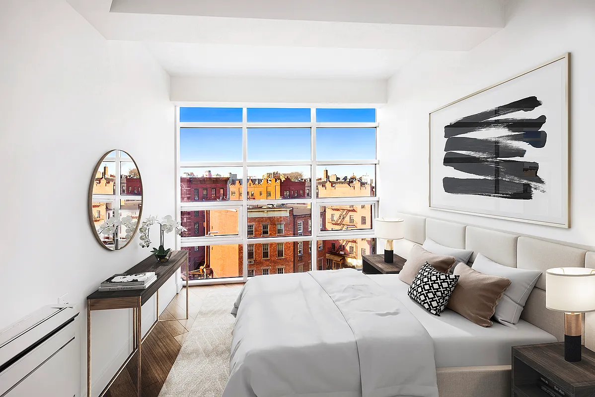 a bedroom with a bed and a cabinets