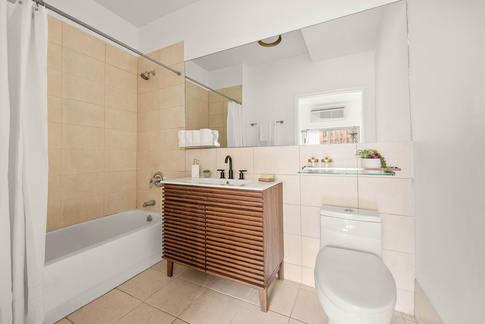 2233 Caton Avenue, Unit 2C Brooklyn, NY 11226 - Photo 6 of 10 a bathroom with a sink a toilet and shower