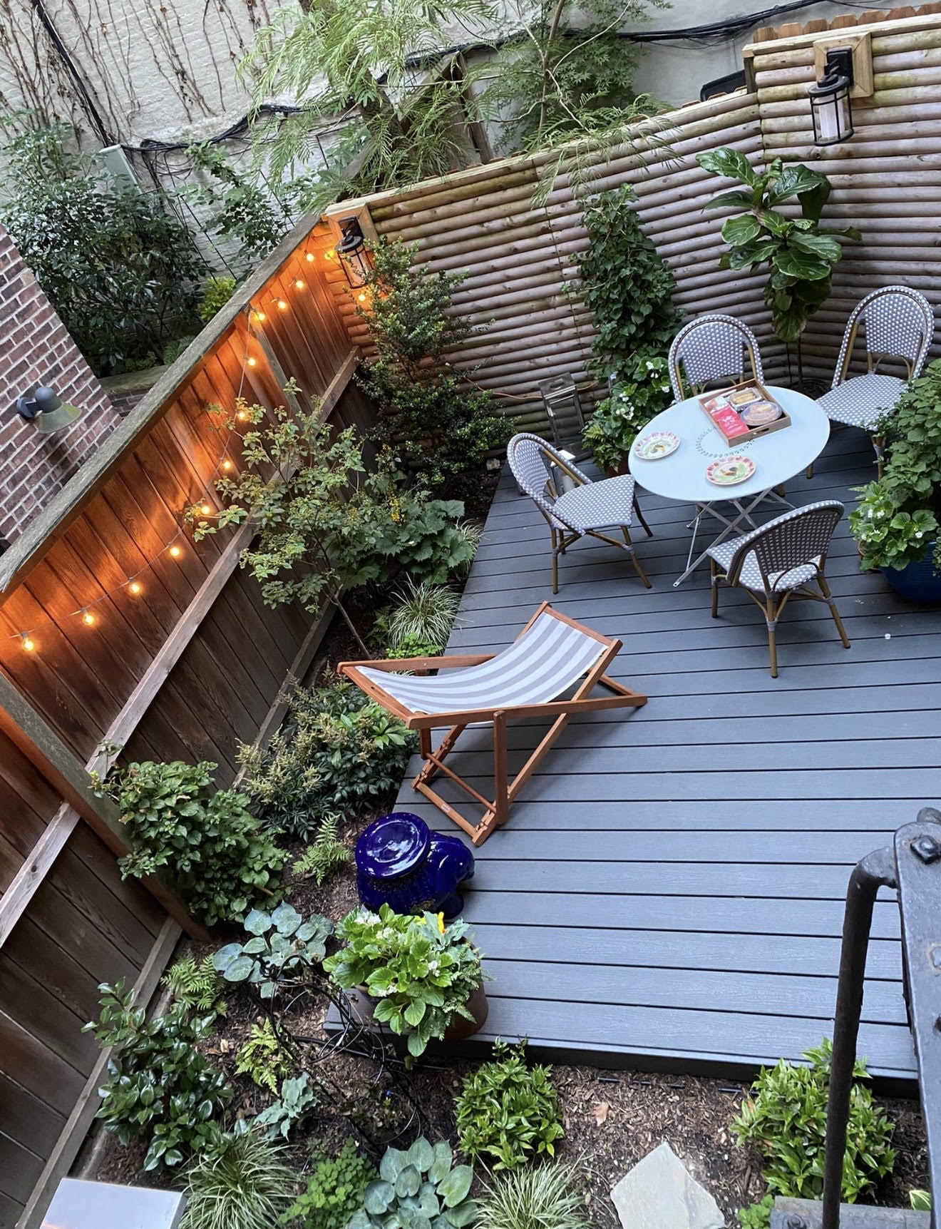 94 Joralemon Street, Unit 2 Brooklyn, NY 11201 - Photo 3 of 15 a backyard of a house with wooden floor and outdoor seating