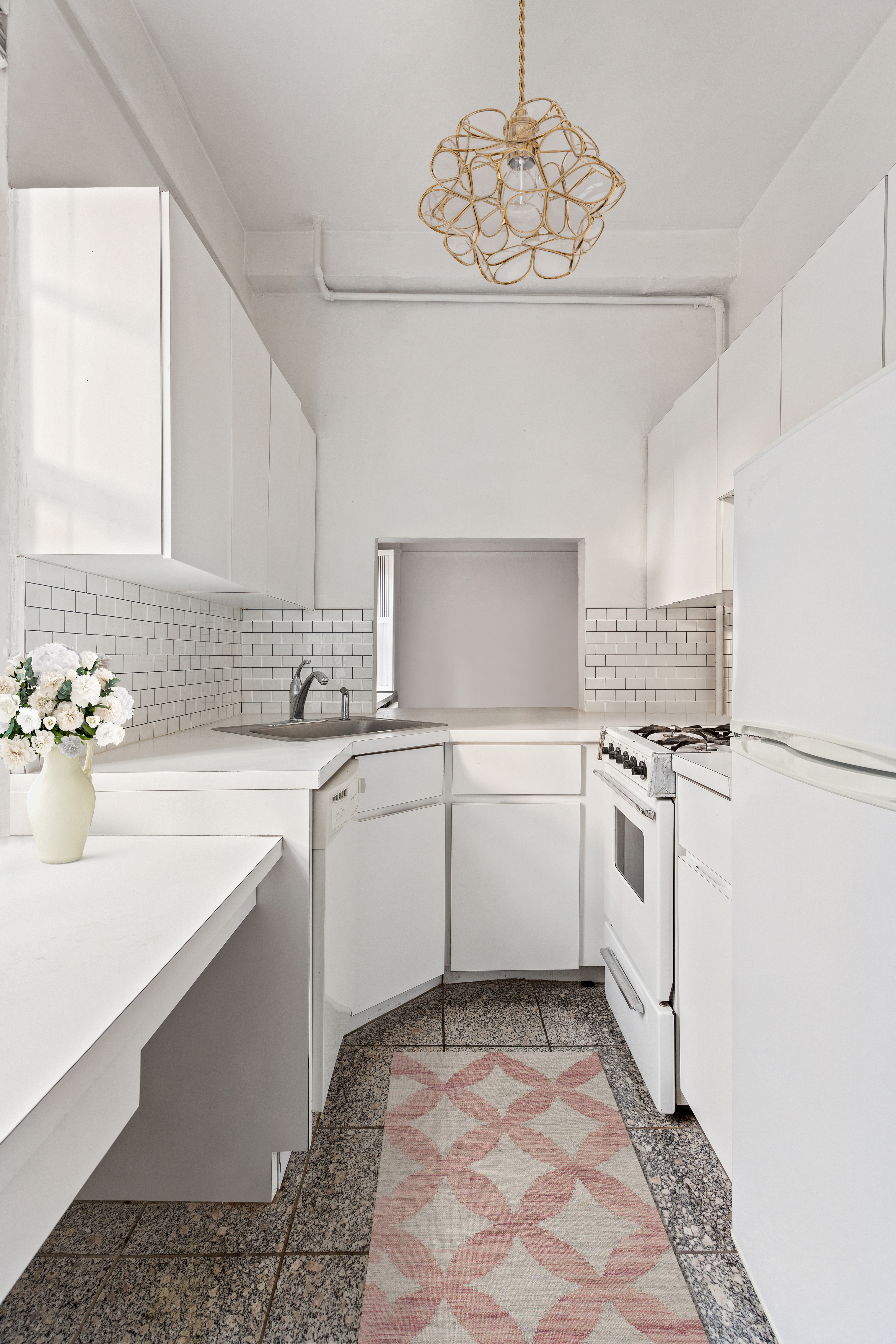 264 Lexington Avenue, Unit 4B Manhattan, NY 10016 - Photo 5 of 10 a kitchen with a sink cabinets and window