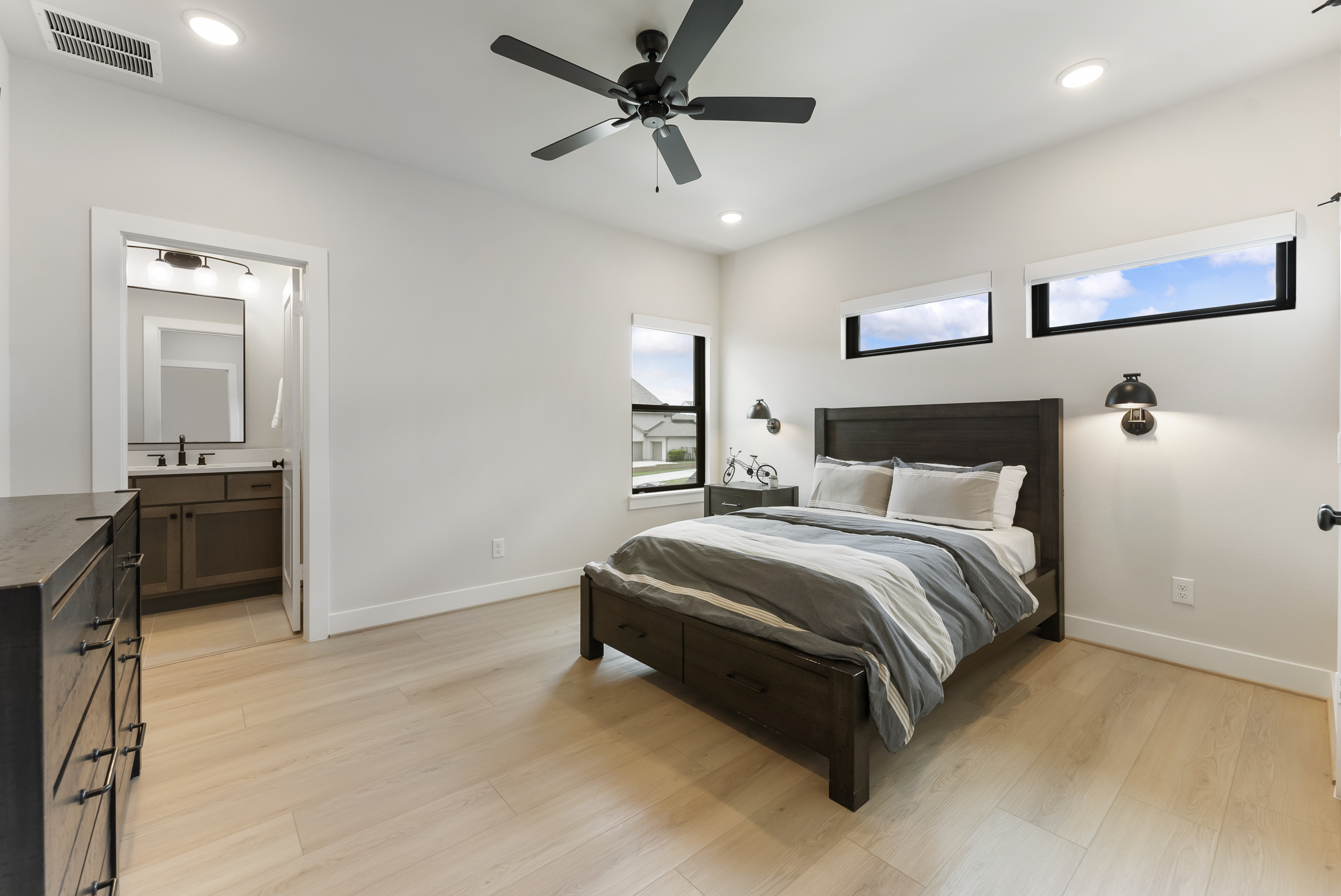 2118 Bennet Court Conroe, TX 77384 - Photo 54 of 70 a bedroom with a bed and a ceiling fan