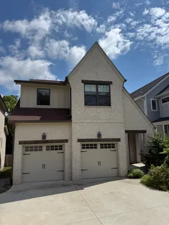a front view of a house with garage