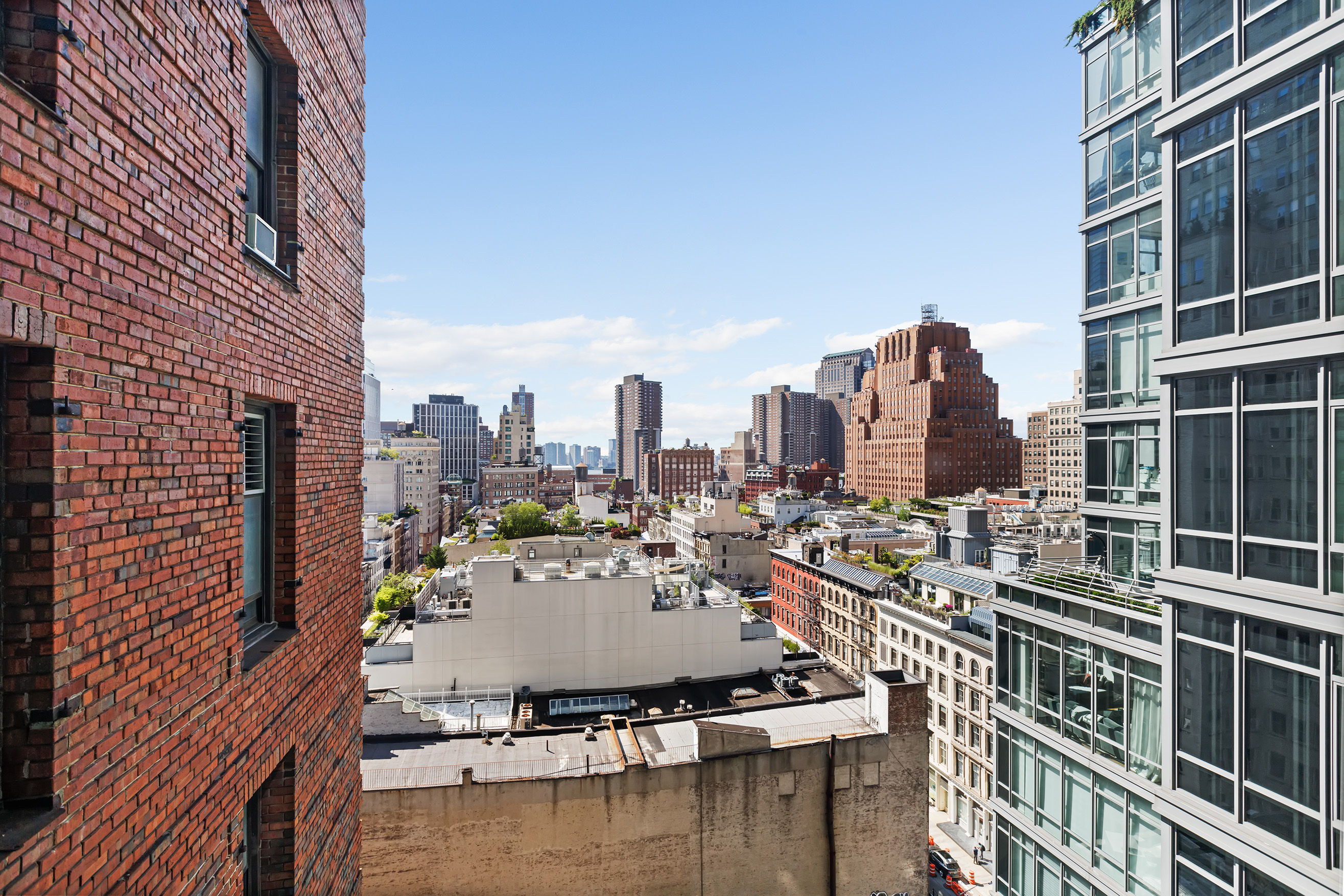 57 Reade Street, Unit 14C Manhattan, NY 10007 - Photo 3 of 16 a view of a city with tall buildings