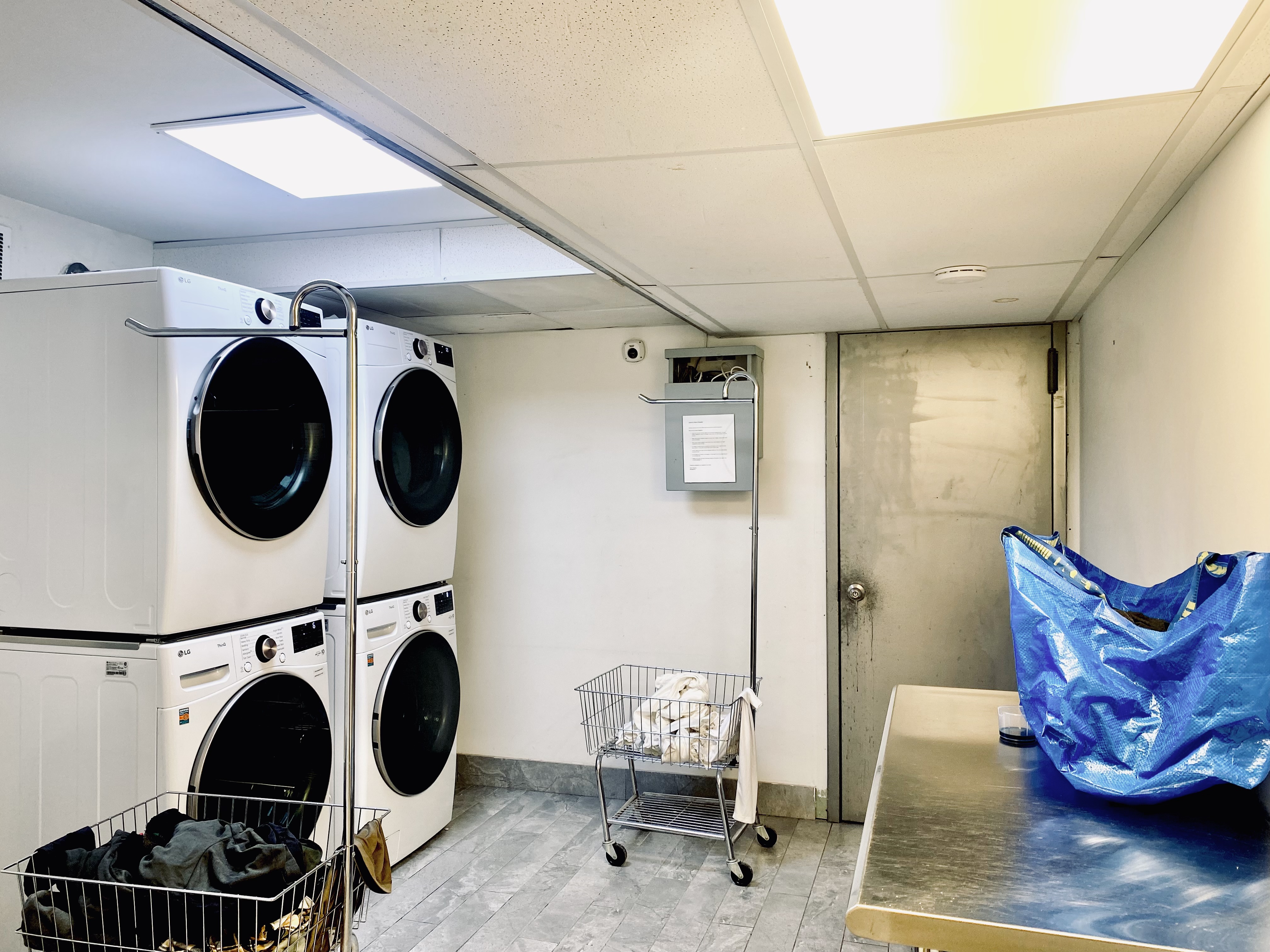 211 8th Avenue, Unit 1C Brooklyn, NY 11215 - Photo 9 of 11 a view of a hallway with washer and dryer