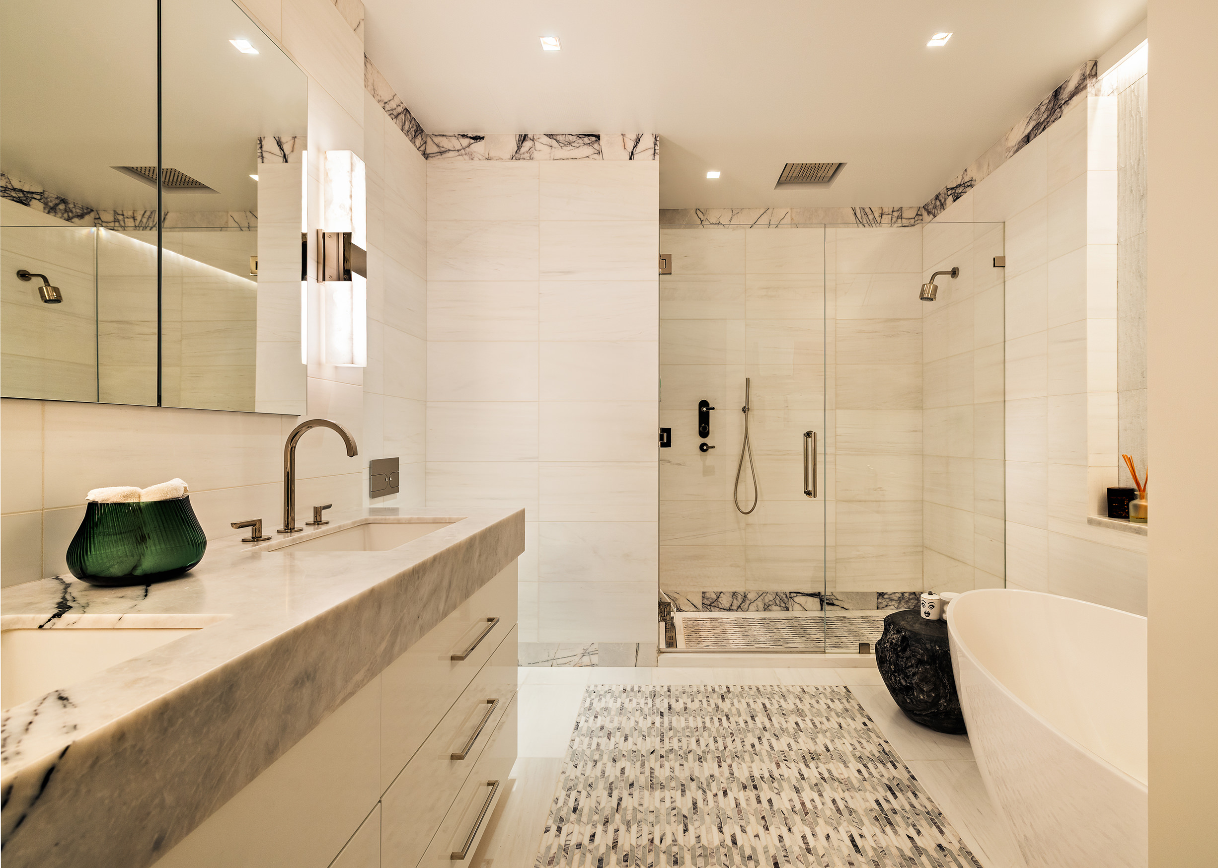 53 Greene Street, Unit 3 Manhattan, NY 10013 - Photo 14 of 22 a bathroom with a double vanity sink and a bathtub