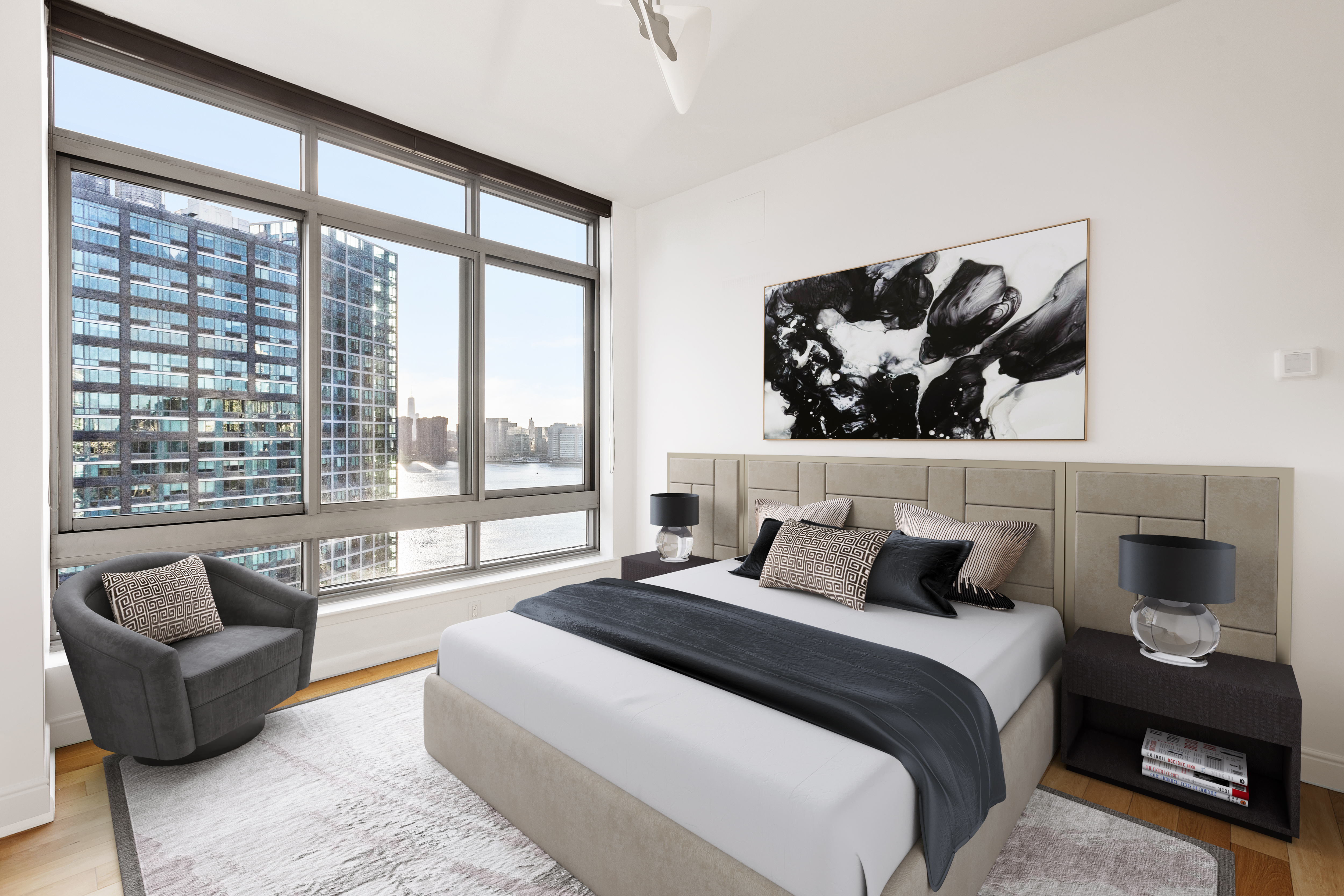 46-30 Center Boulevard, Unit PH8 Queens, NY 11109 - Photo 12 of 32 a bedroom with a bed and a couch next to a large window