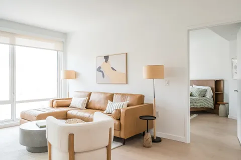 a bedroom with furniture and a lamp