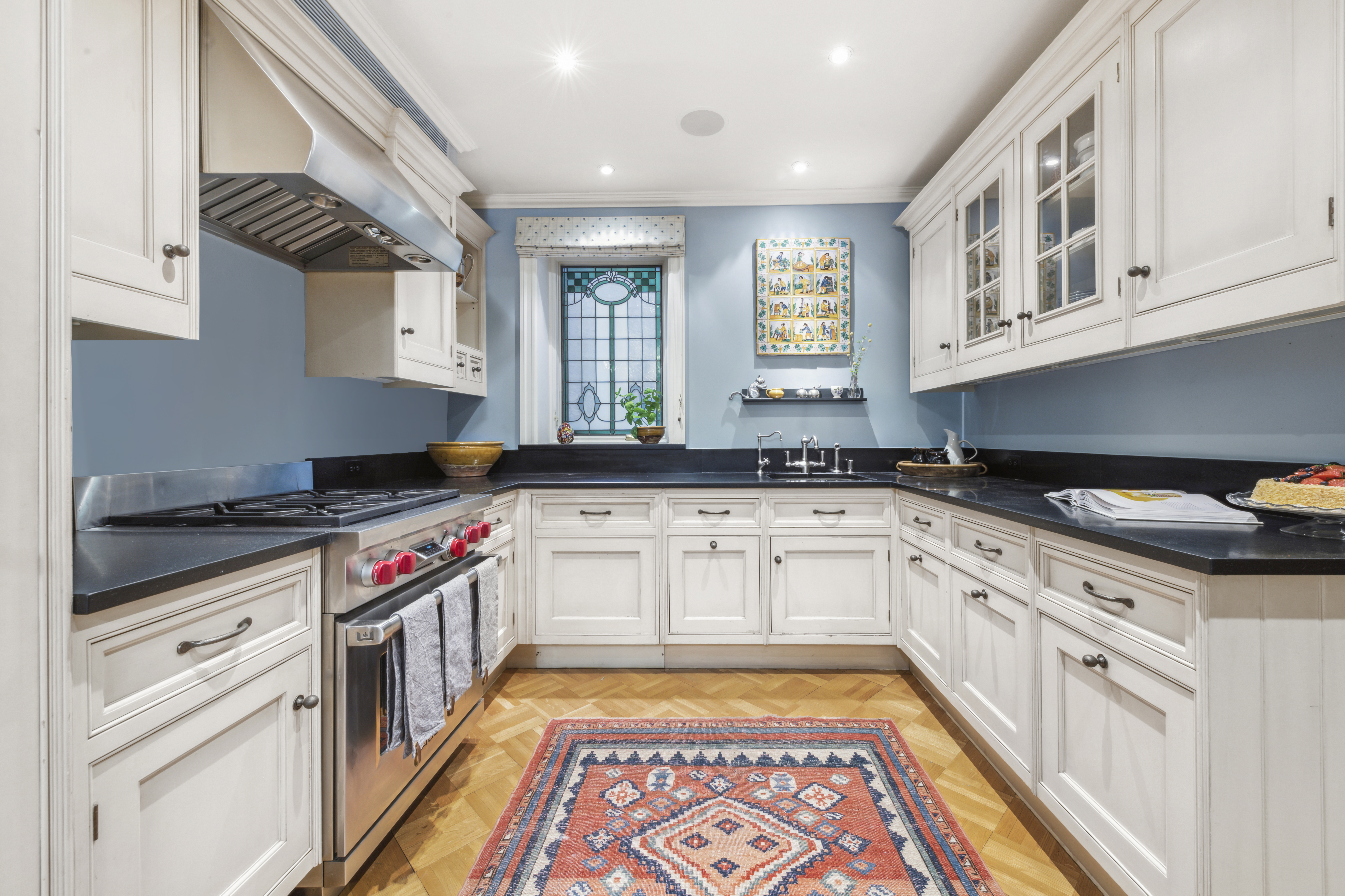 67 Riverside Drive, Unit 1A Manhattan, NY 10024 - Photo 4 of 18 a kitchen with granite countertop stainless steel appliances sink and cabinets