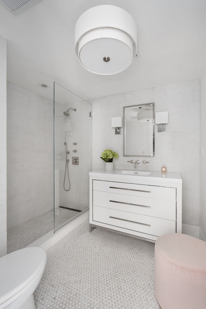 520 East 89th Street Manhattan, NY 10128 - Photo 24 of 40 a bathroom with a sink a toilet and shower