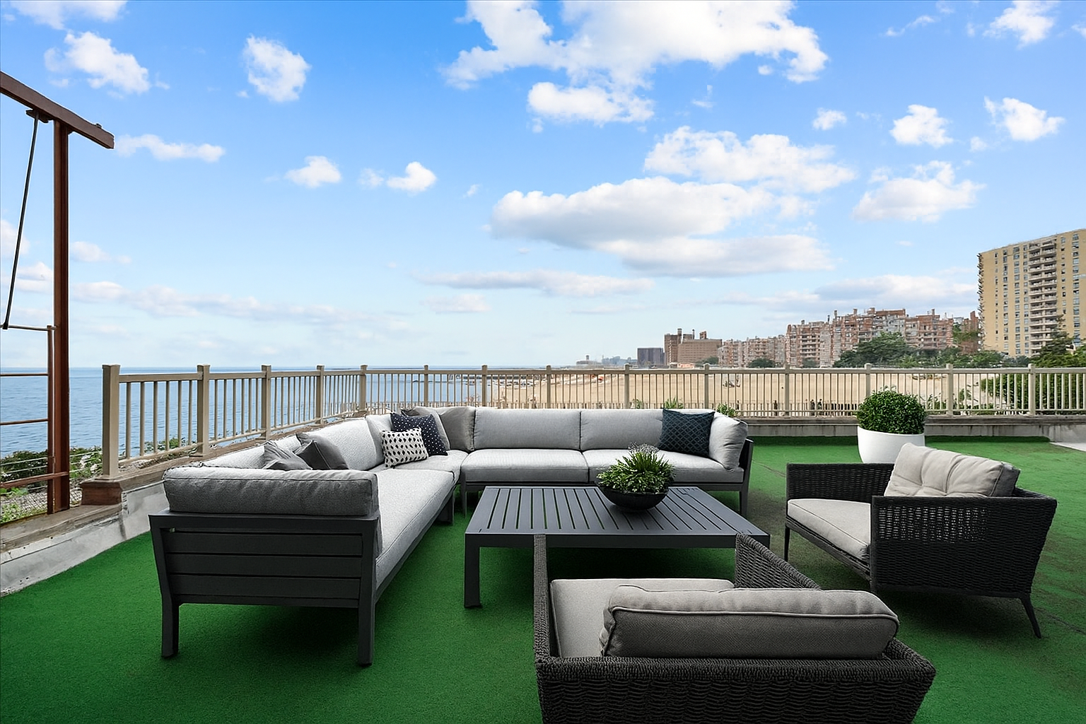286 Corbin Place, Unit 1D Brooklyn, NY 11235 - Photo 2 of 12 a roof deck with couches and potted plants