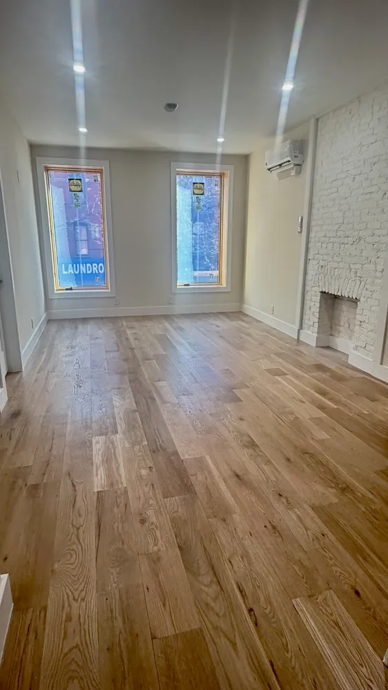 a large kitchen with cabinets and stainless steel appliances