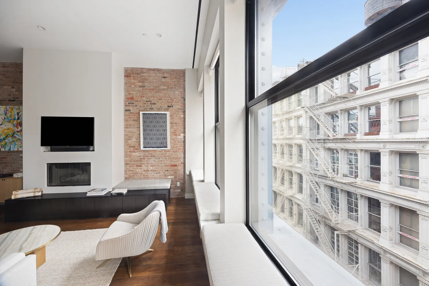 a living room with fireplace furniture and a flat screen tv
