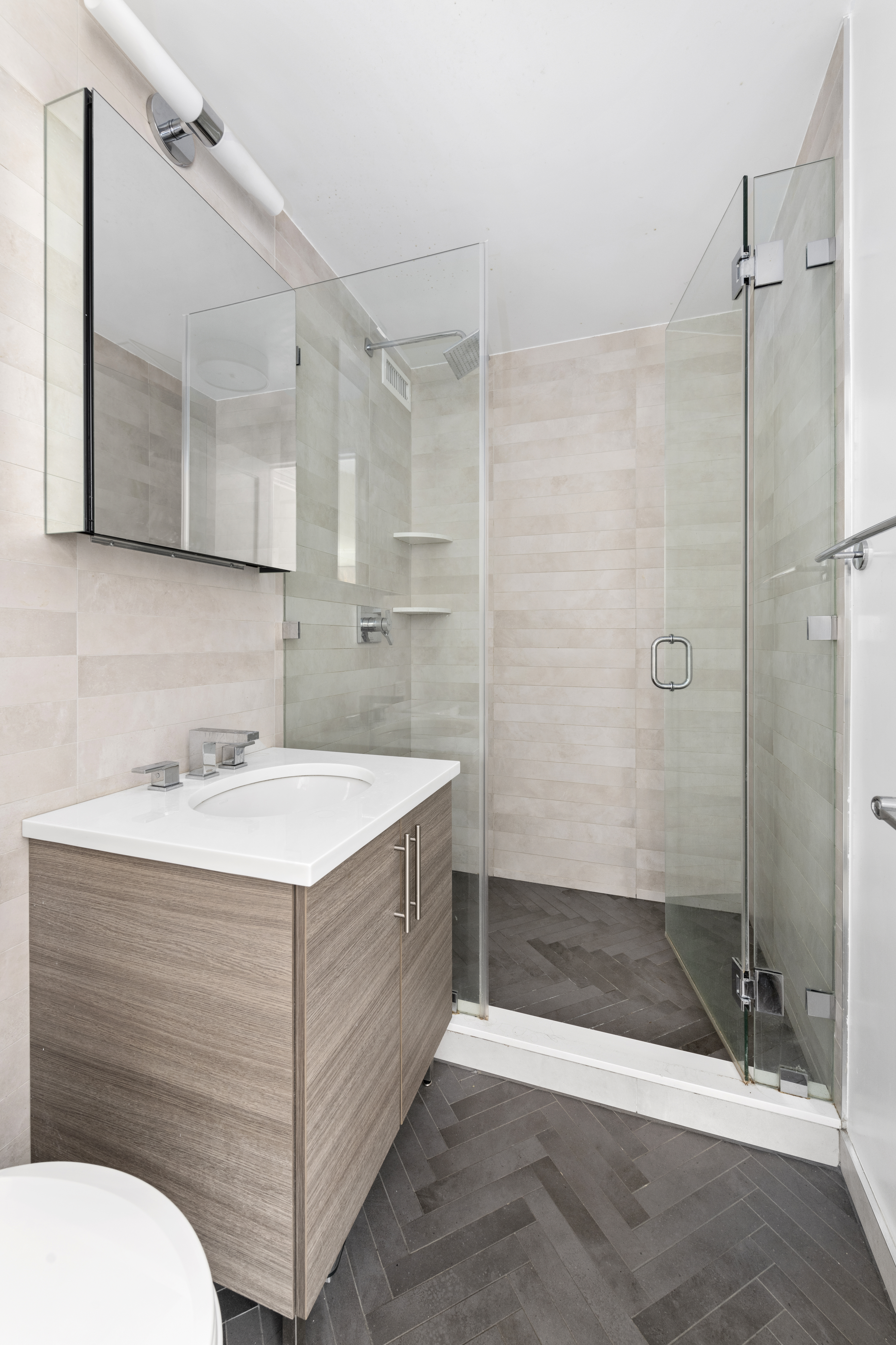 333 East 34th Street, Unit 10H Manhattan, NY 10016 - Photo 10 of 16 a bathroom with a sink a toilet and shower