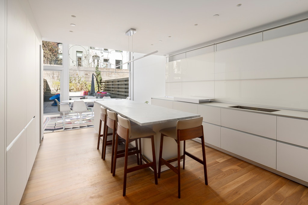 125 West 87th Street Manhattan, NY 10024 - Photo 7 of 27 a view of a dining room with furniture and wooden floor