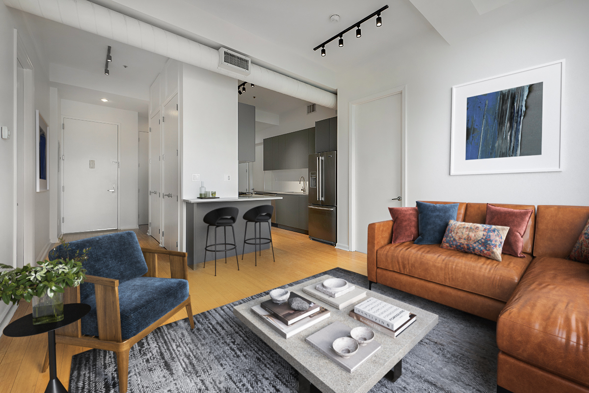 a living room with furniture and wooden floor