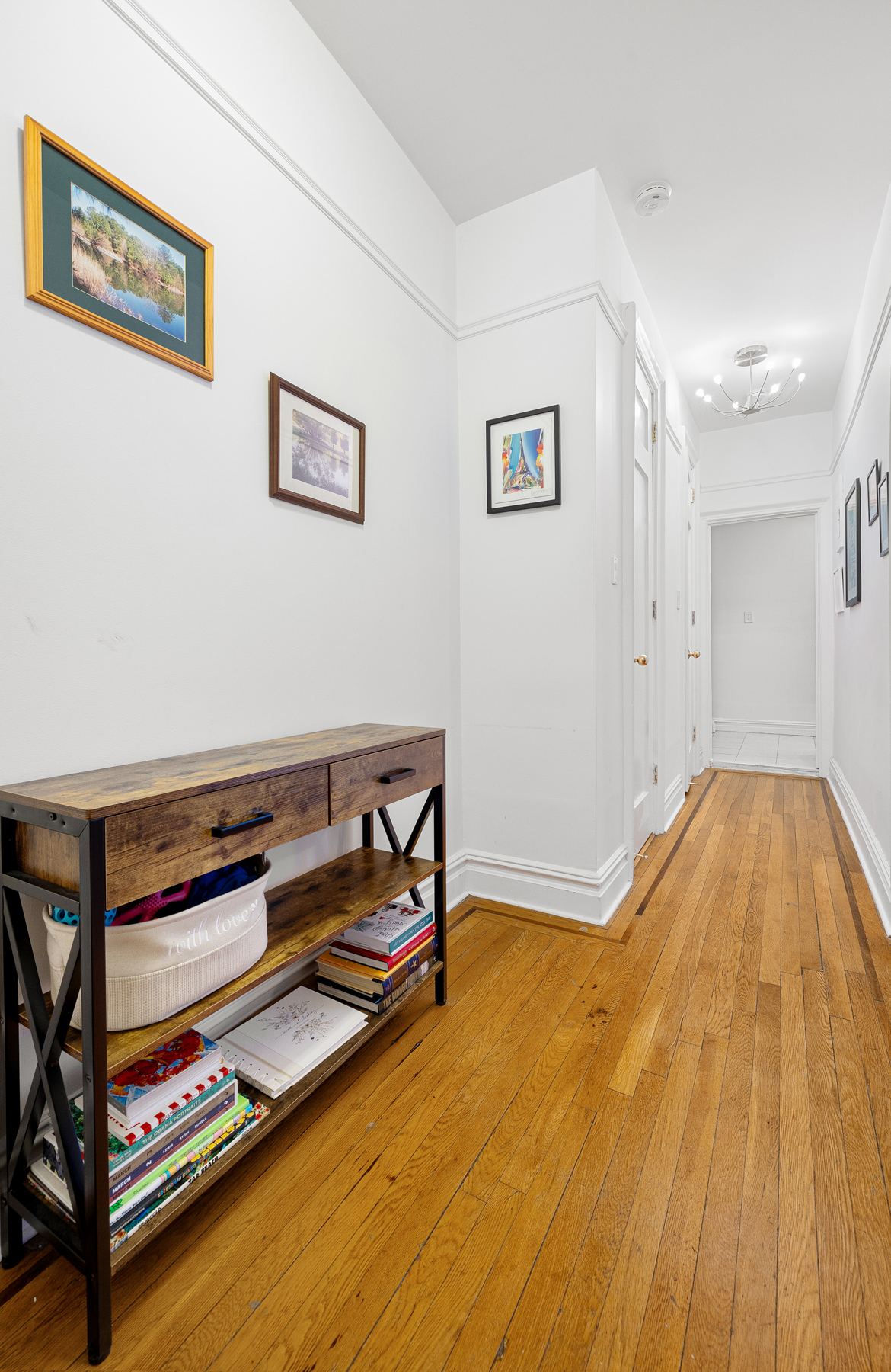 255 Eastern Parkway, Unit C5 Brooklyn, NY 11238 - Photo 4 of 9 a bedroom with a bed and a table