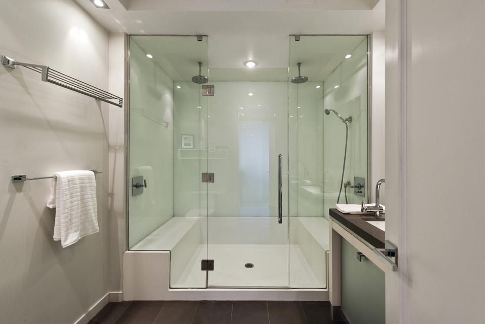 444 West 19th Street, Unit 201 Manhattan, NY 10011 - Photo 7 of 13 a bathroom with a tub shower vanity and a sink