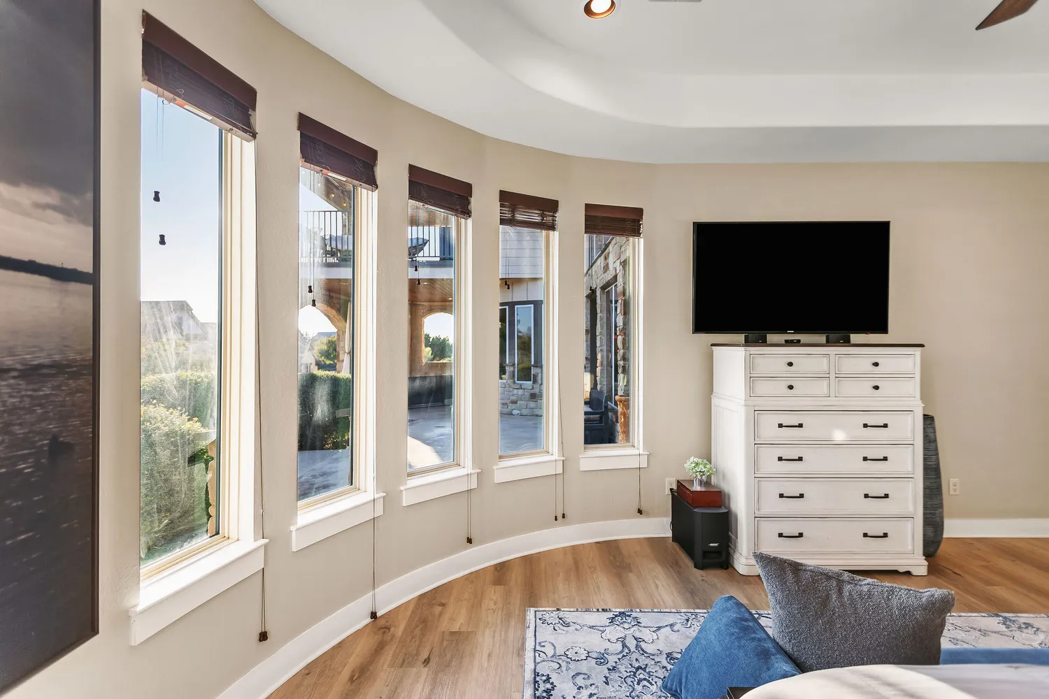 a backyard of a house with table and chairs