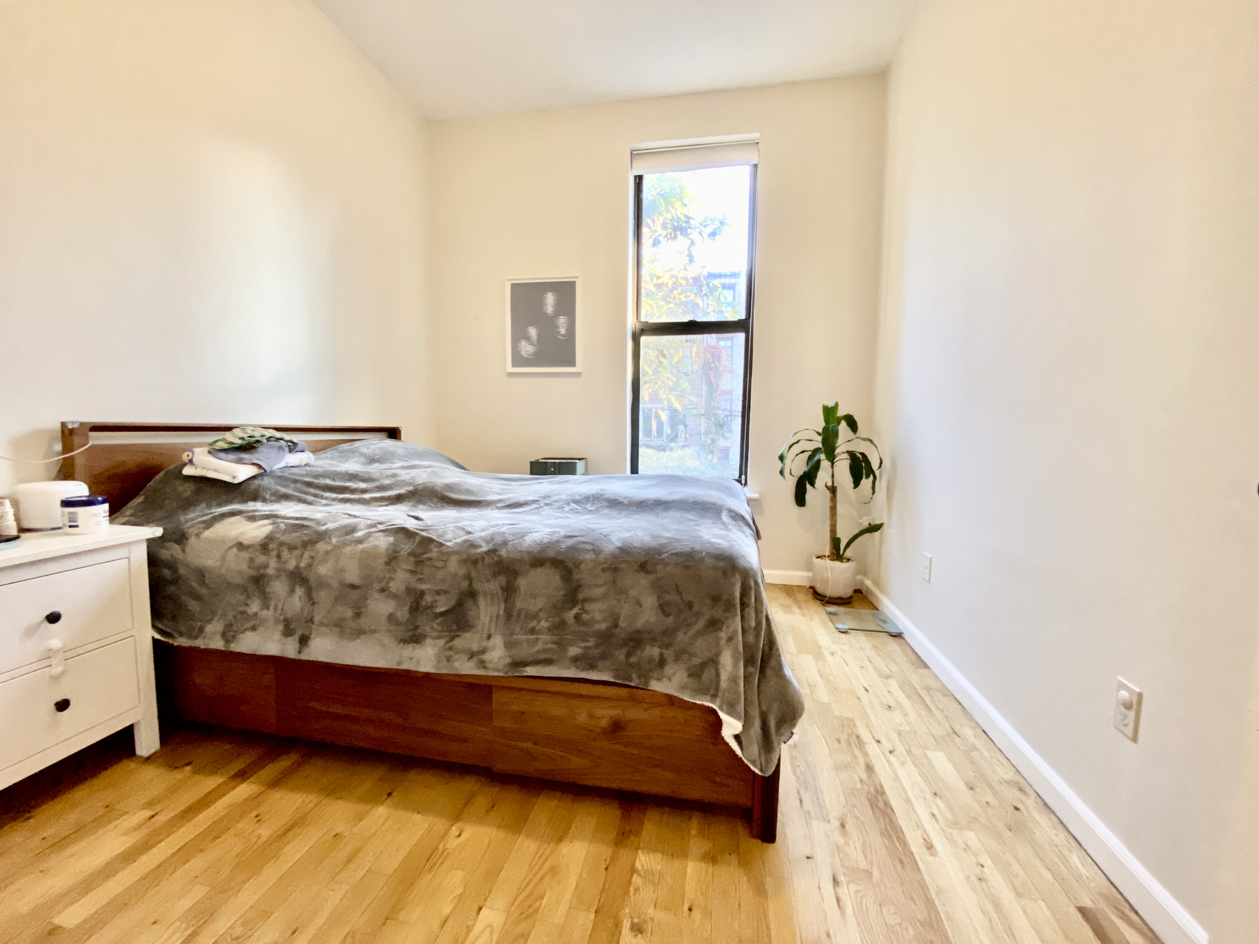 602 Madison Street, Unit 2 Brooklyn, NY 11221 - Photo 8 of 10 a bedroom with a bed and a window