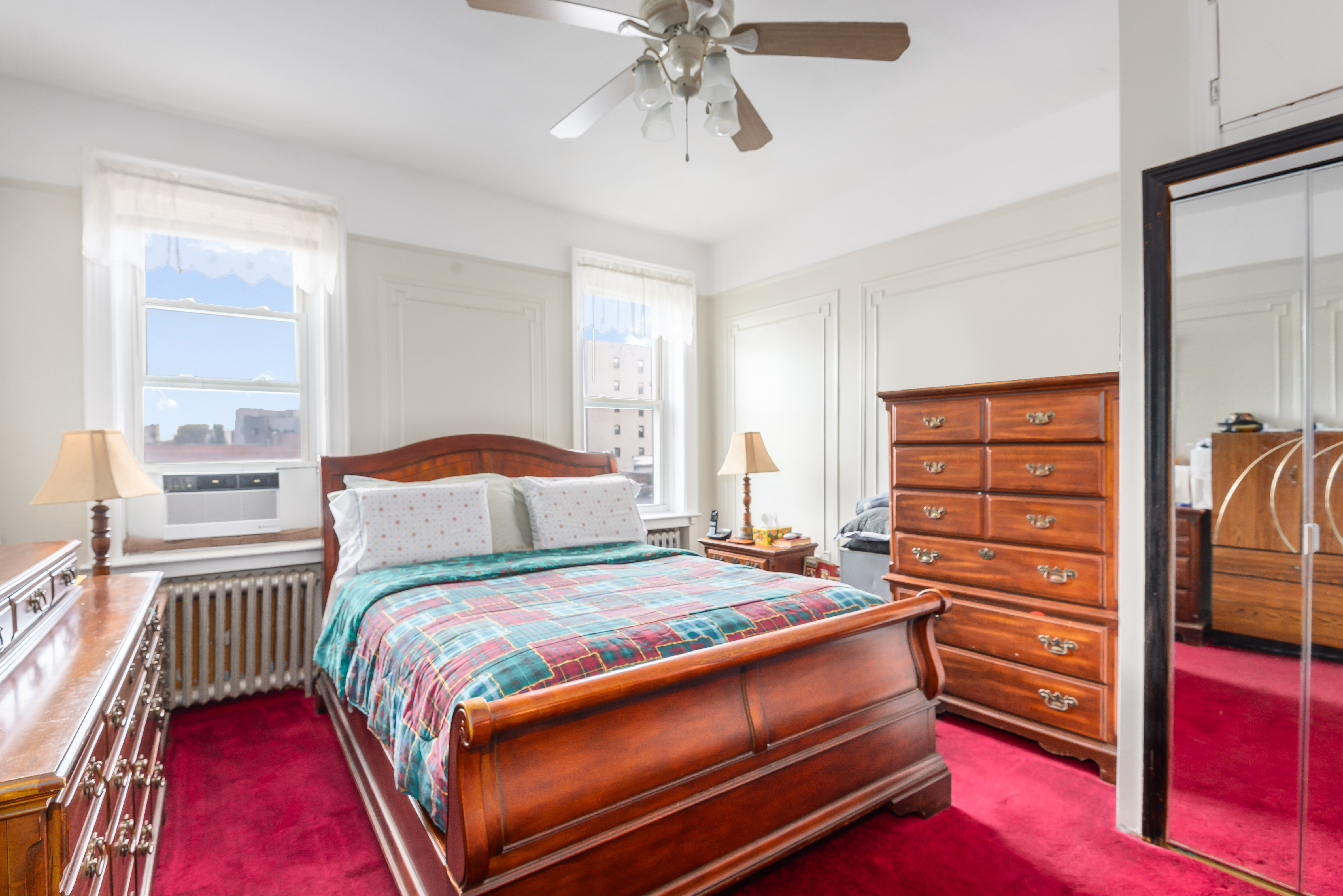 15 Lloyd Street Brooklyn, NY 11226 - Photo 10 of 18 a bedroom with a bed and a window