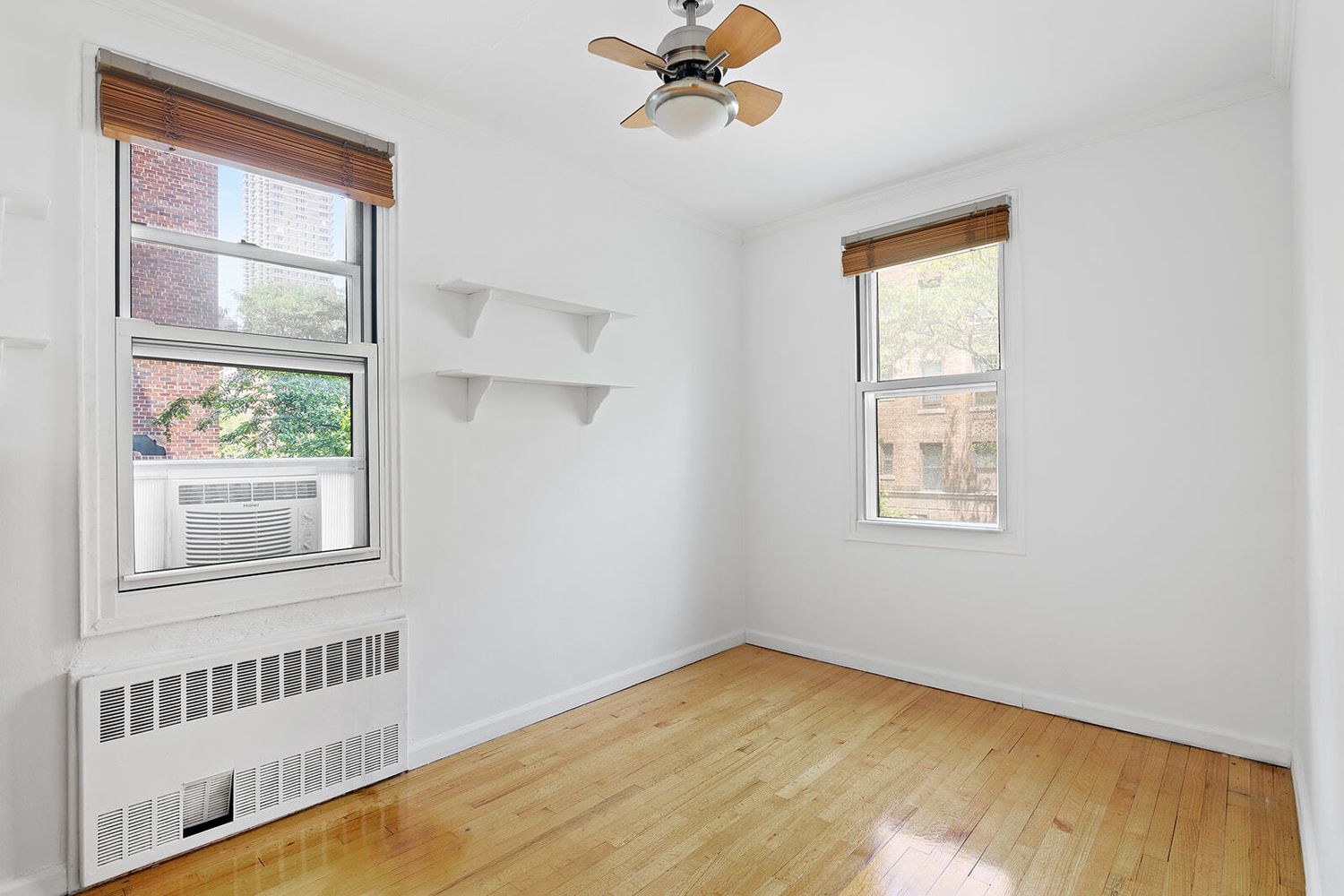 302 East 88th Street, Unit 3F Manhattan, NY 10128 - Photo 6 of 6 a view of an empty room with a window