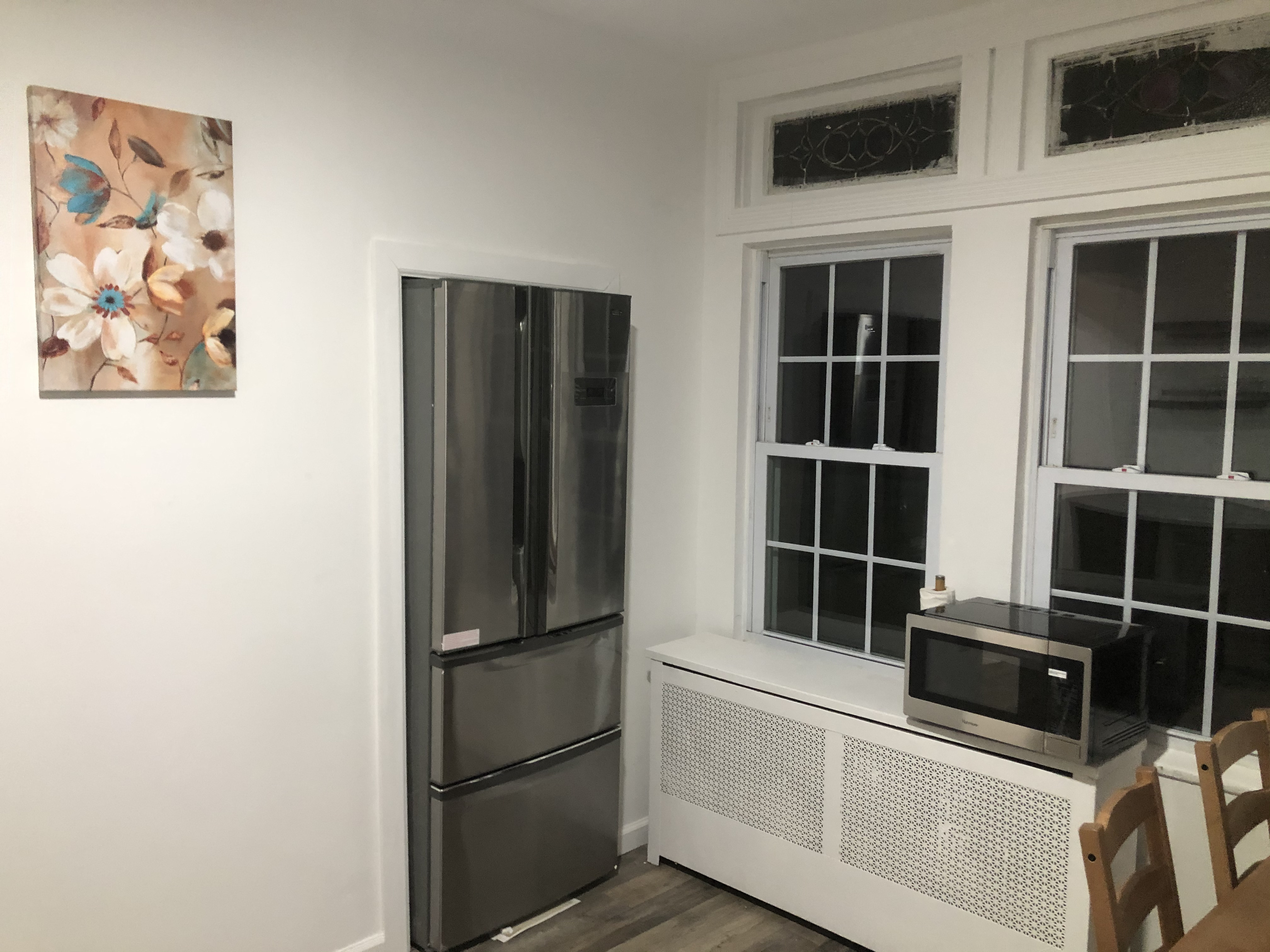 1112 Beverley Road Brooklyn, NY 11218 - Photo 18 of 53 a kitchen with a refrigerator and cabinets