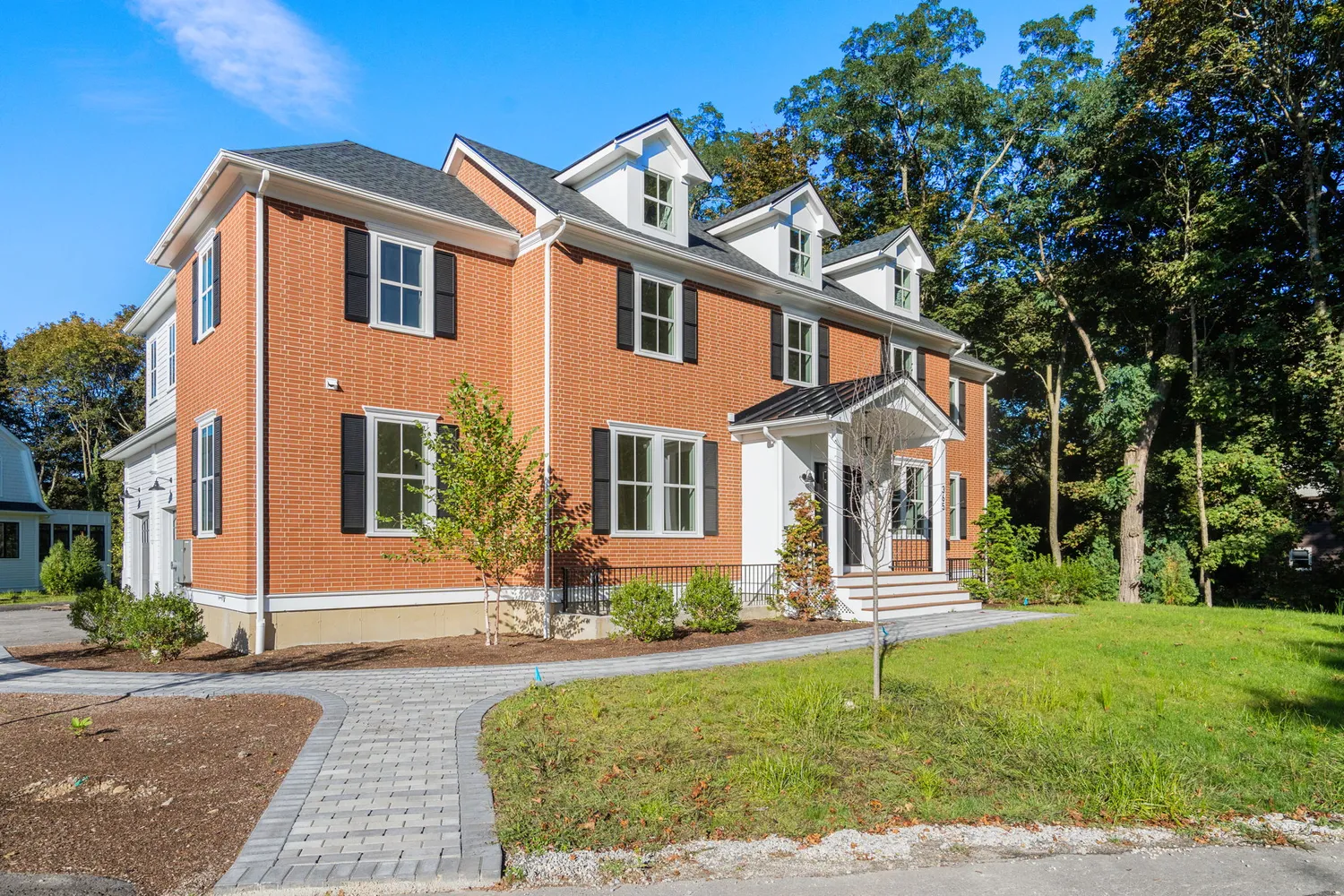 front view of a house with a yard