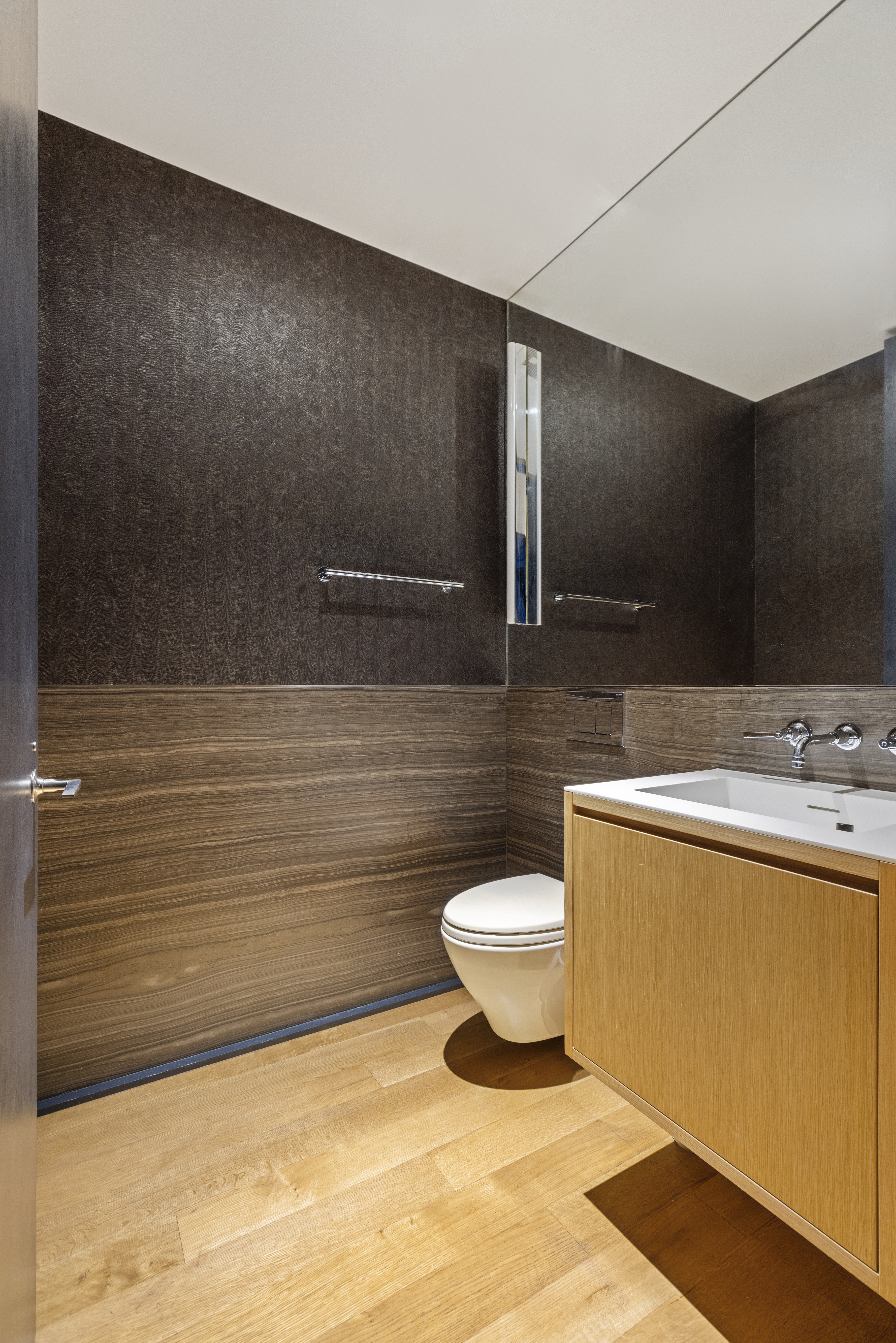 71 Reade Street, Unit 5A Manhattan, NY 10007 - Photo 20 of 27 a bathroom with a sink a toilet and mirror