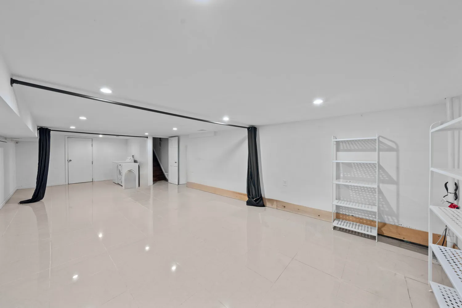 an empty room with a closet and a window