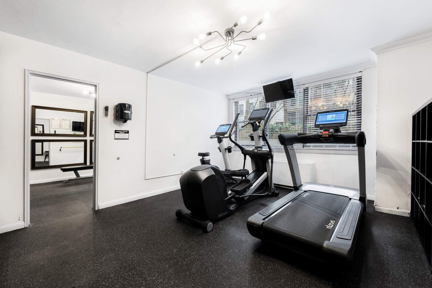 420 East 51st Street, Unit 10H Manhattan, NY 10022 - Photo 9 of 14 a view of a room with gym equipment