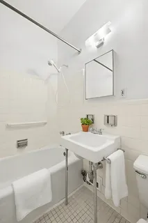 a bathroom with a sink toilet and a bathtub