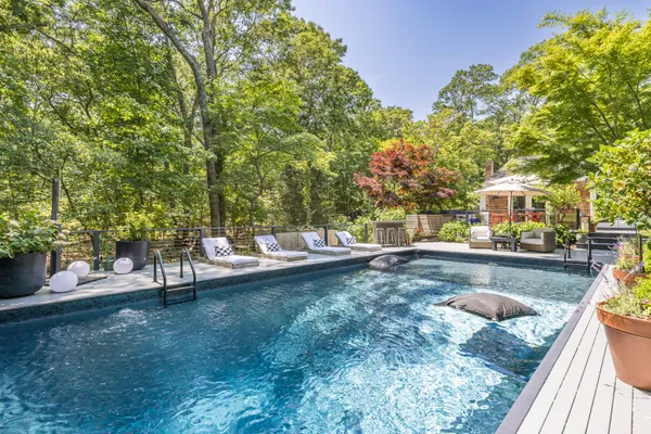 a view of a swimming pool with a patio