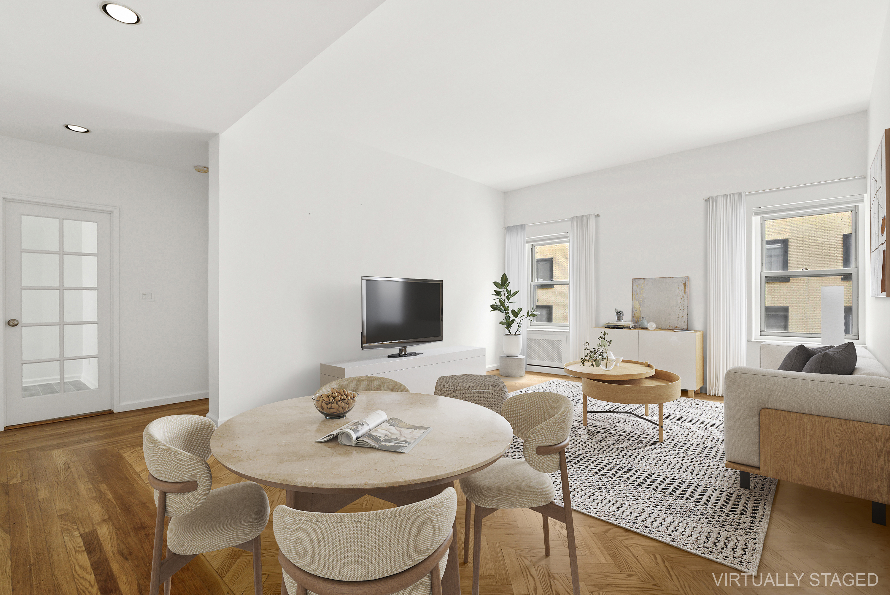 57 West 58th Street, Unit 10E Manhattan, NY 10019 - Photo 1 of 5 a view of a dining room with furniture