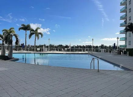 a view of swimming pool and outdoor seating