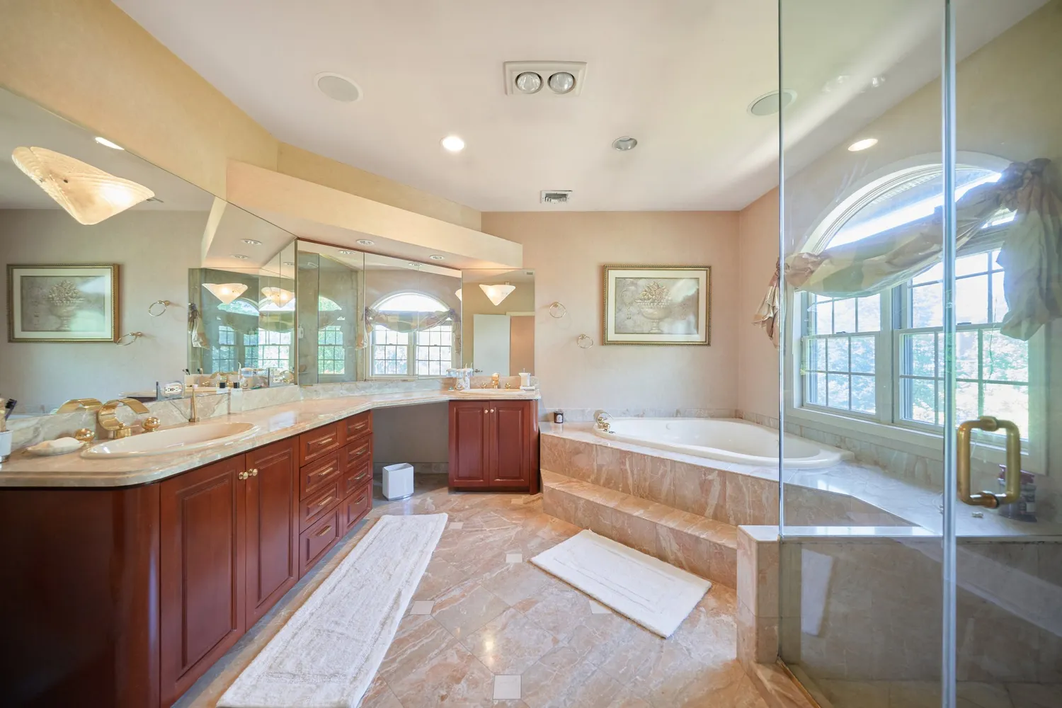 a spacious bedroom with a bed and a mirror