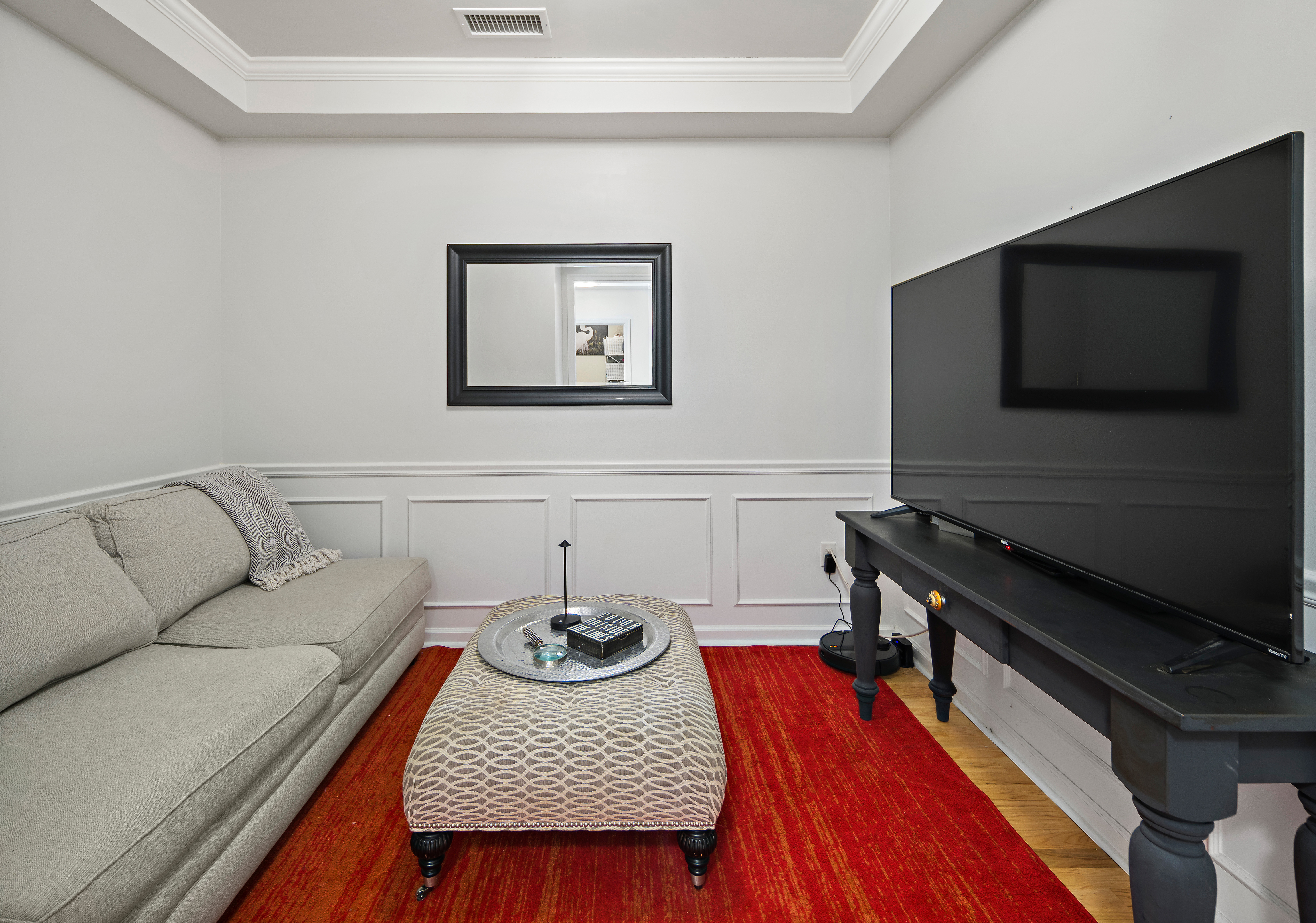 107 Clocktower Drive, Unit 407 Waltham, MA 02452 - Photo 9 of 19 a living room with furniture and a flat screen tv