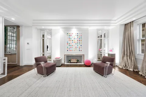 a living room with furniture fireplace and a flat screen tv