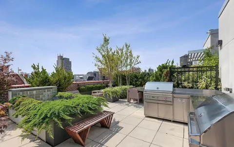 a view of a backyard with sitting area