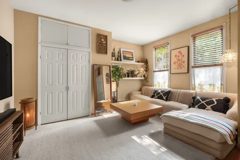 a bedroom with furniture and a window