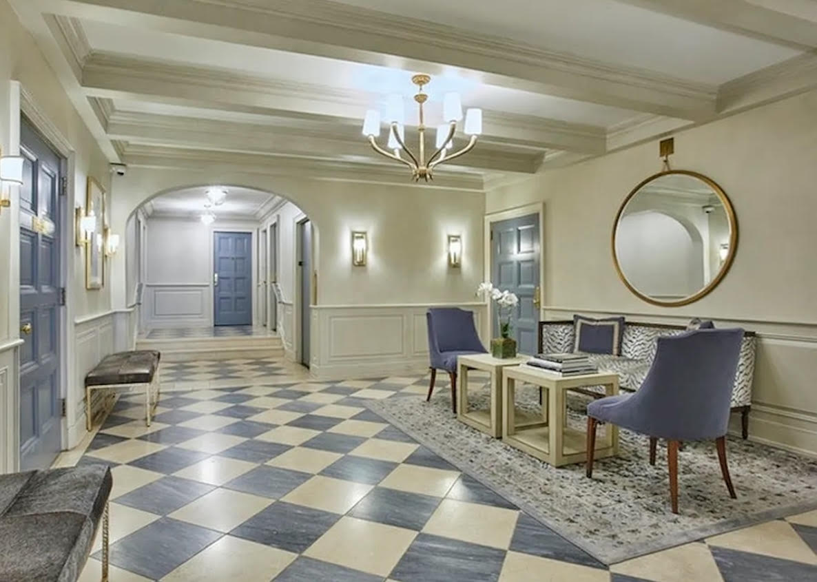 210 East 73rd Street, Unit 9EF Manhattan, NY 10021 - Photo 11 of 16 a living room with a couch and a chandelier