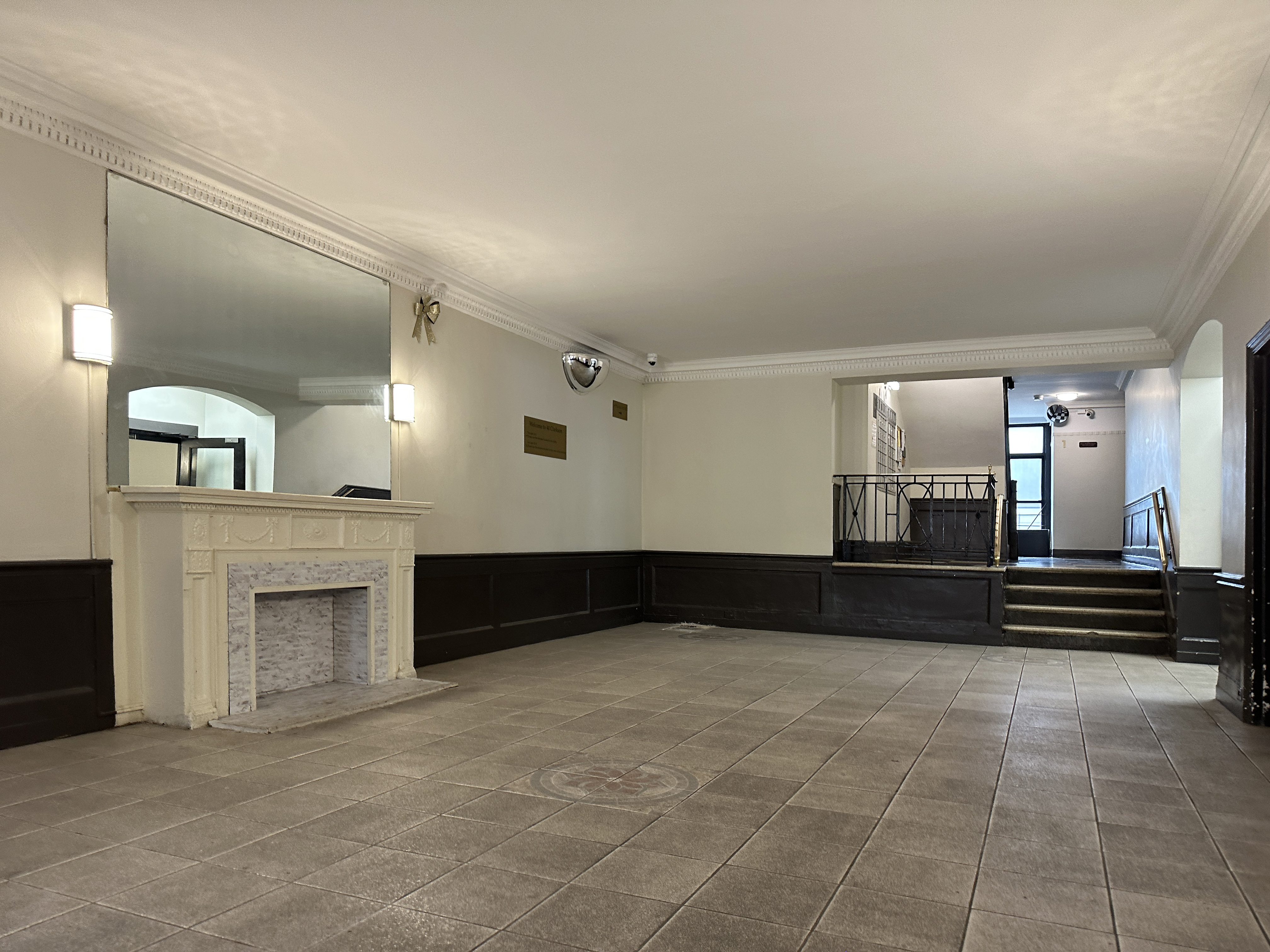 40 Clarkson Avenue, Unit 2L Brooklyn, NY 11226 - Photo 9 of 11 a living room with furniture and a fireplace