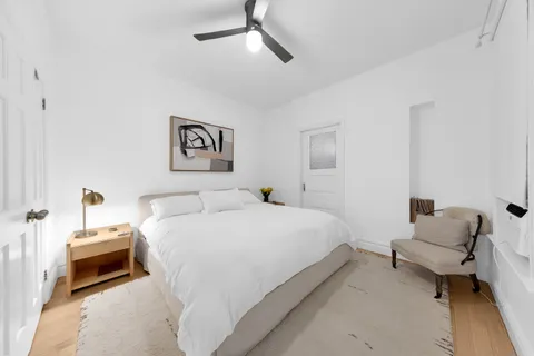 a bedroom with a bed and a couch