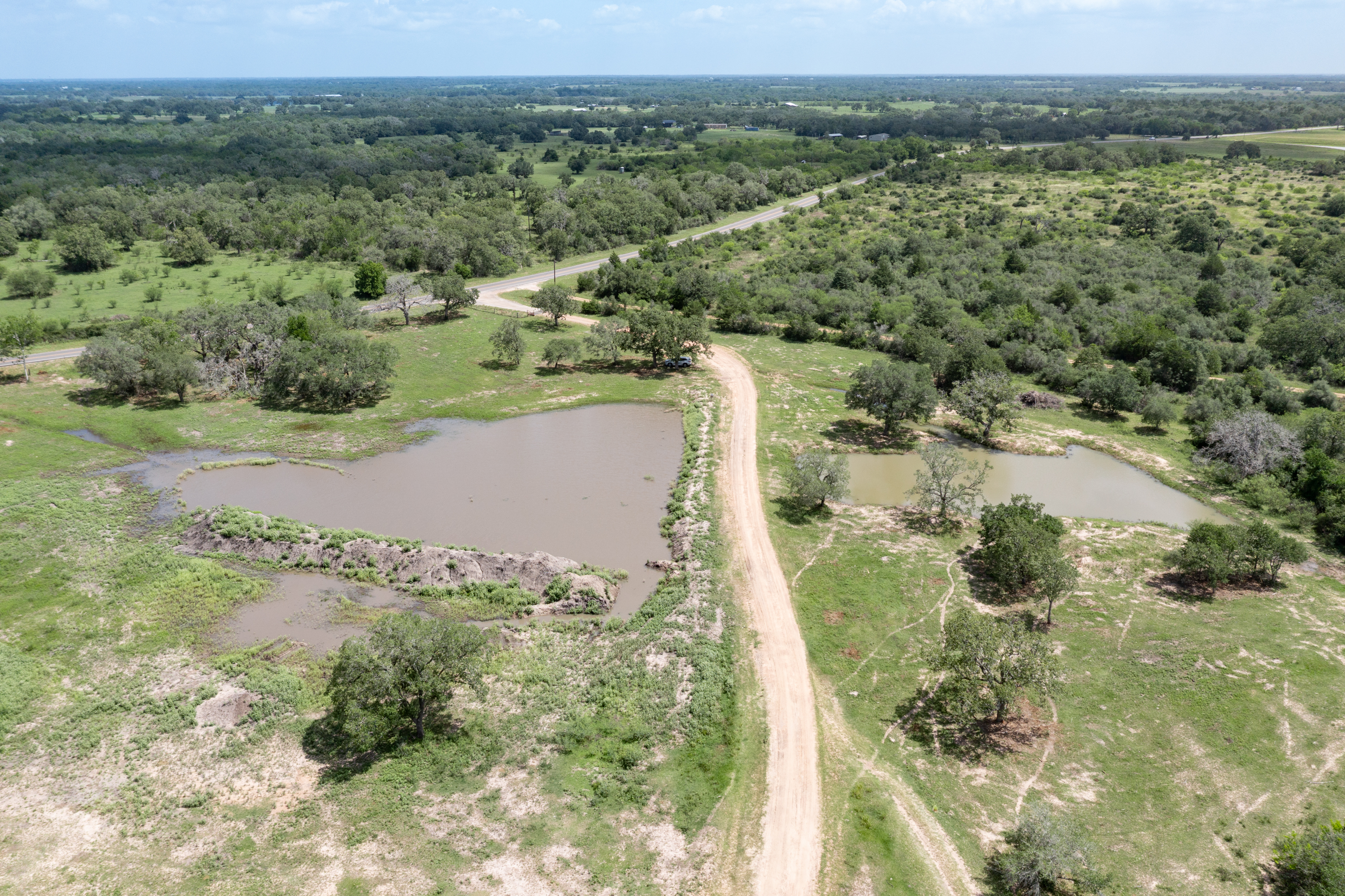 54.68 Cattle Guard Road Cuero, TX 77954 - Photo 55 of 67 a view of a lake with a city view