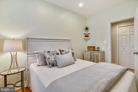 a bedroom with a bed and a lamp