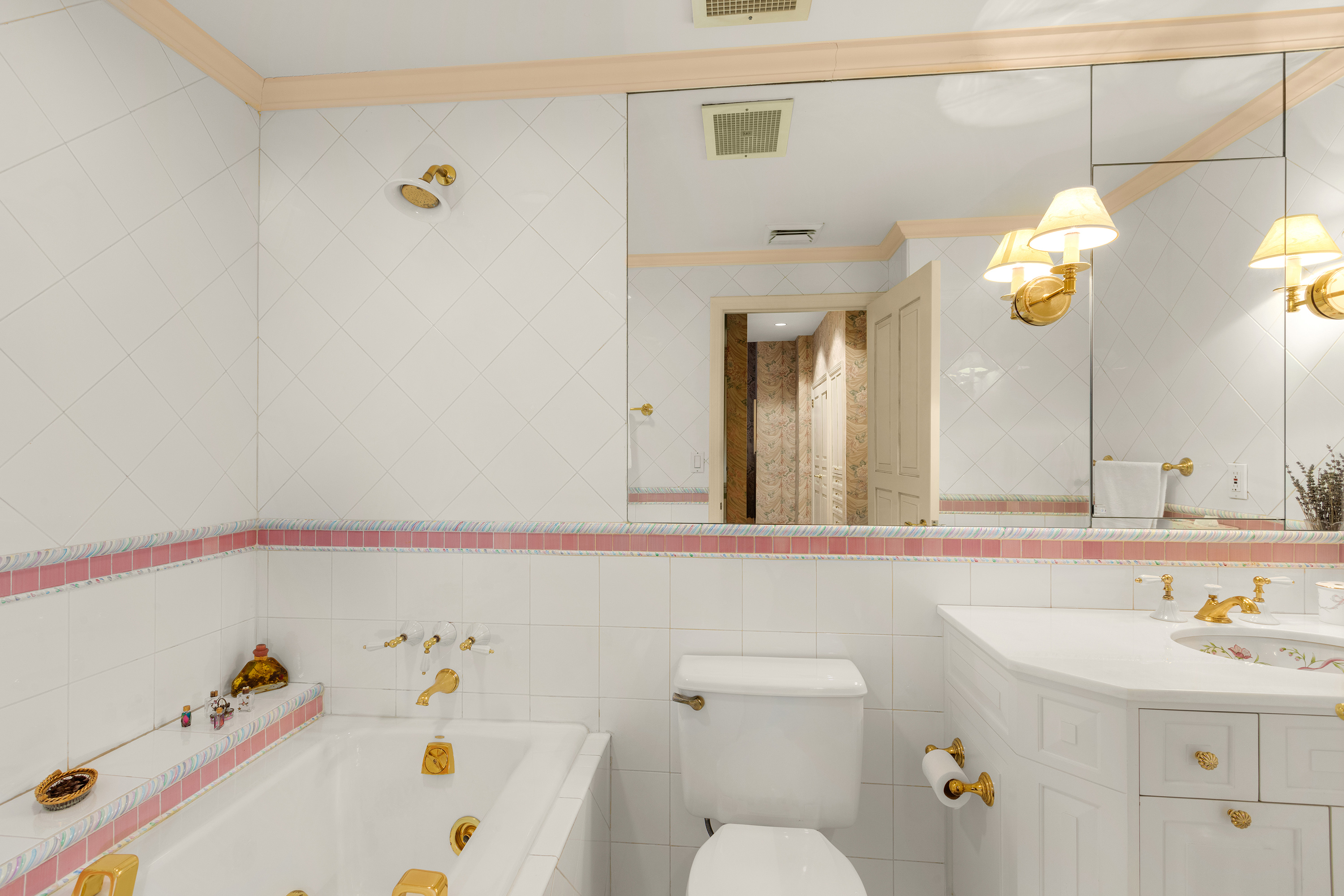 2 East End Avenue, Unit PHG Manhattan, NY 10075 - Photo 9 of 15 a bathroom with a sink and a mirror