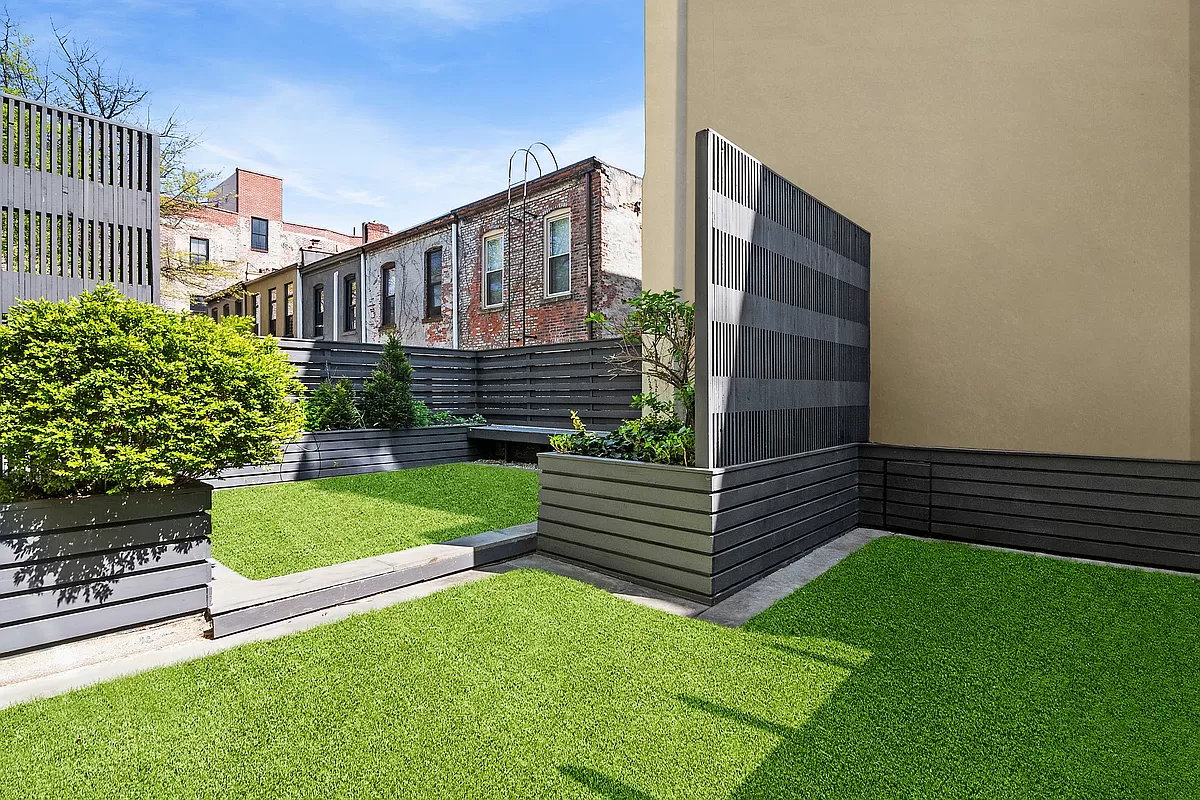 180 Bainbridge Street, Unit 111 Brooklyn, NY 11233 - Photo 18 of 25 a view of outdoor space and yard
